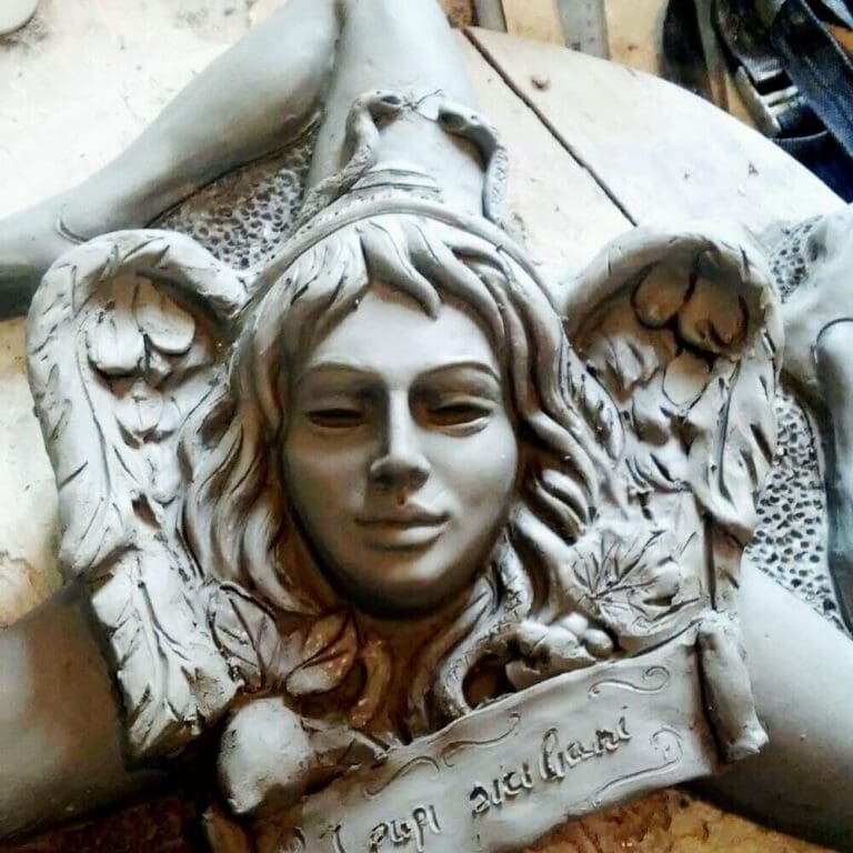 I Pupi Siciliani logo af sten